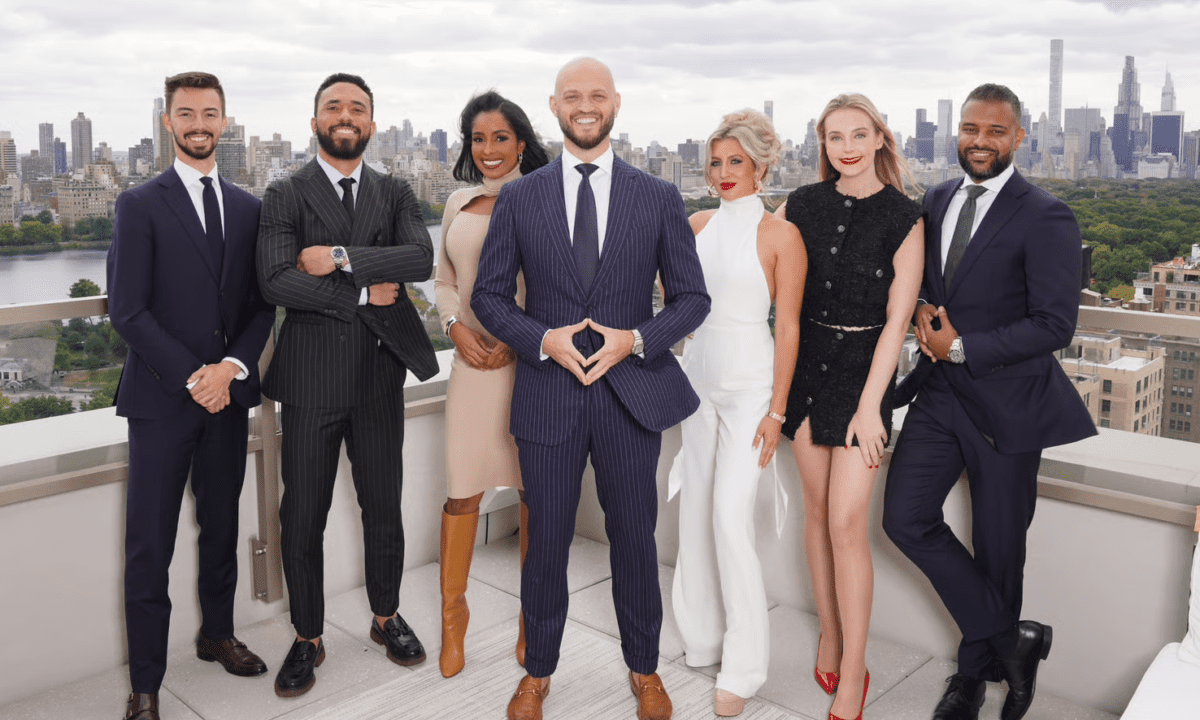The Nile Lundgren team poses at the top of a building in New York City